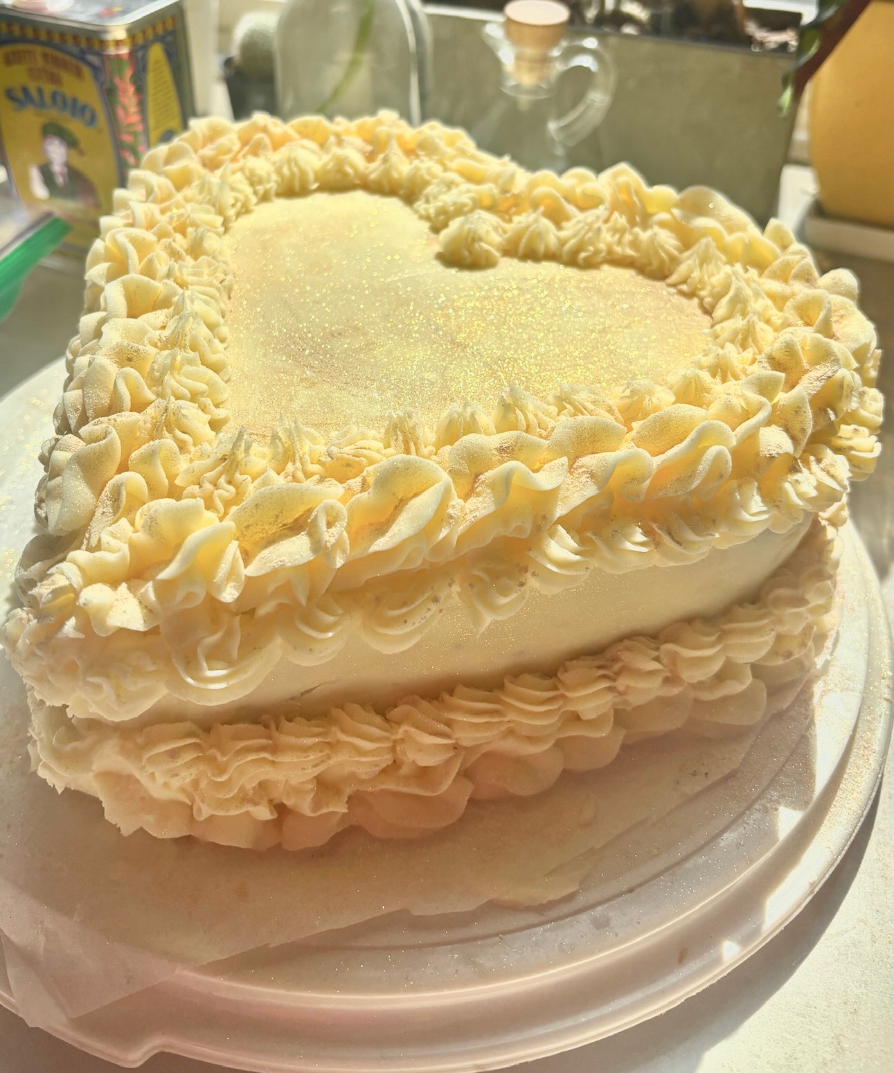 Heart-shaped cake with iridescent glitter frosting