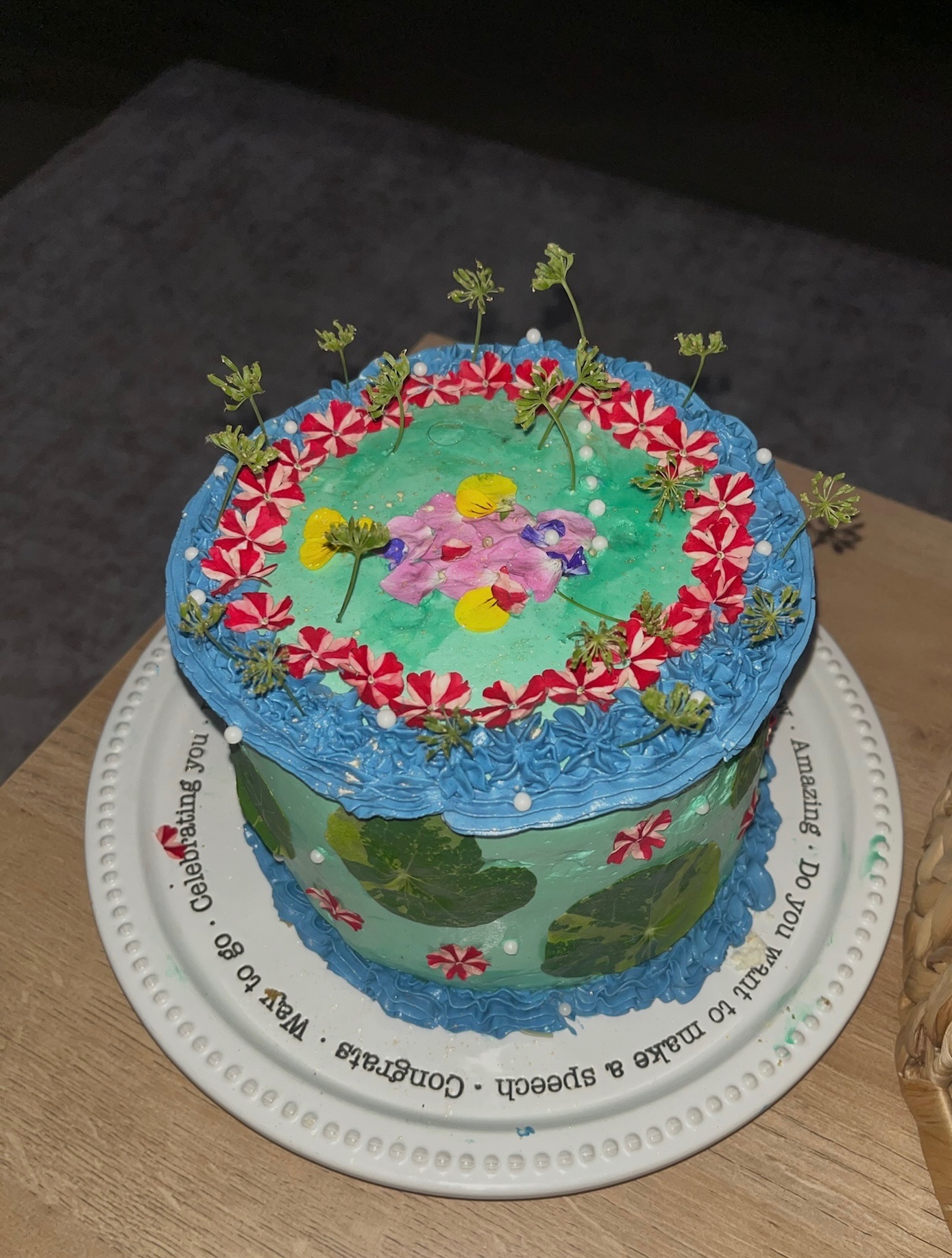 Blue and green garden cake on celebration plate